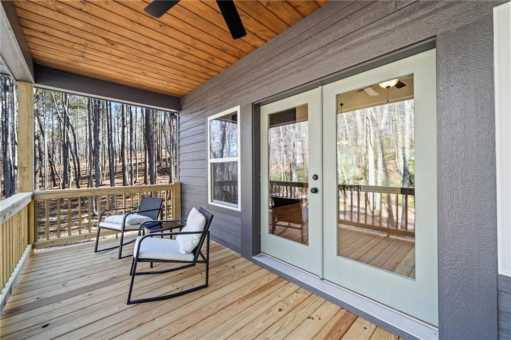246 Woodward Way Talking Rock, GA 30175 - Photo 27 of 39 a balcony with chairs and wooden floor