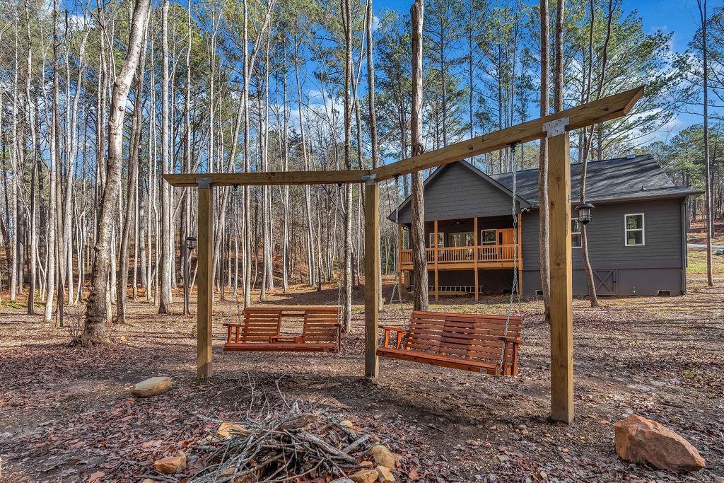246 Woodward Way Talking Rock, GA 30175 - Photo 34 of 39 a backyard of a house with barbeque oven