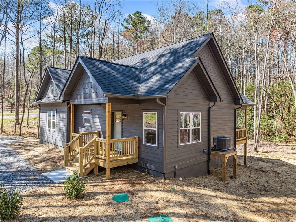 246 Woodward Way Talking Rock, GA 30175 - Photo 38 of 39 a front view of a house with garden