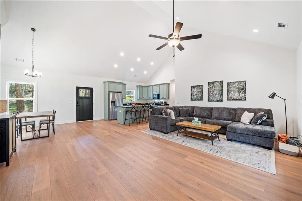 246 Woodward Way Talking Rock, GA 30175 - Photo 4 of 39 a living room with furniture and a wooden floor