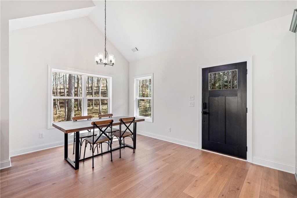 246 Woodward Way Talking Rock, GA 30175 - Photo 5 of 39 a view of a dining room with furniture window and wooden floor