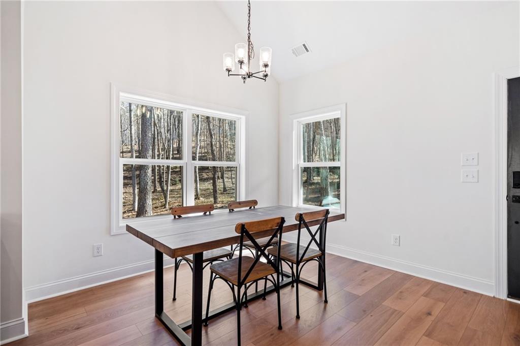 246 Woodward Way Talking Rock, GA 30175 - Photo 6 of 39 a view of a dining room with furniture window and wooden floor