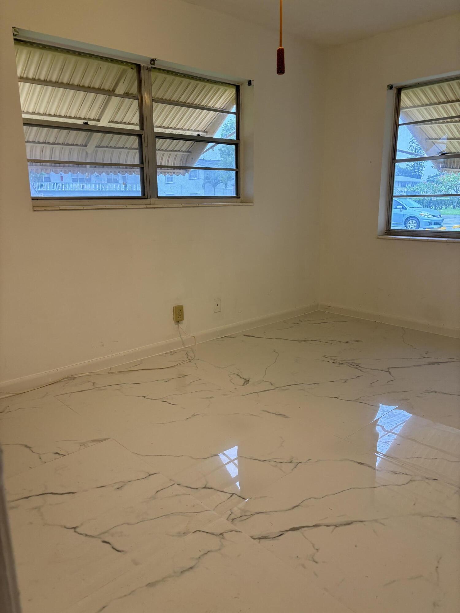 204 Salisbury I, Unit 204 West Palm Beach, FL 33417 - Photo 4 of 14 a bathroom with a shower