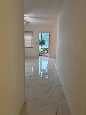 a view of entryway with kitchen