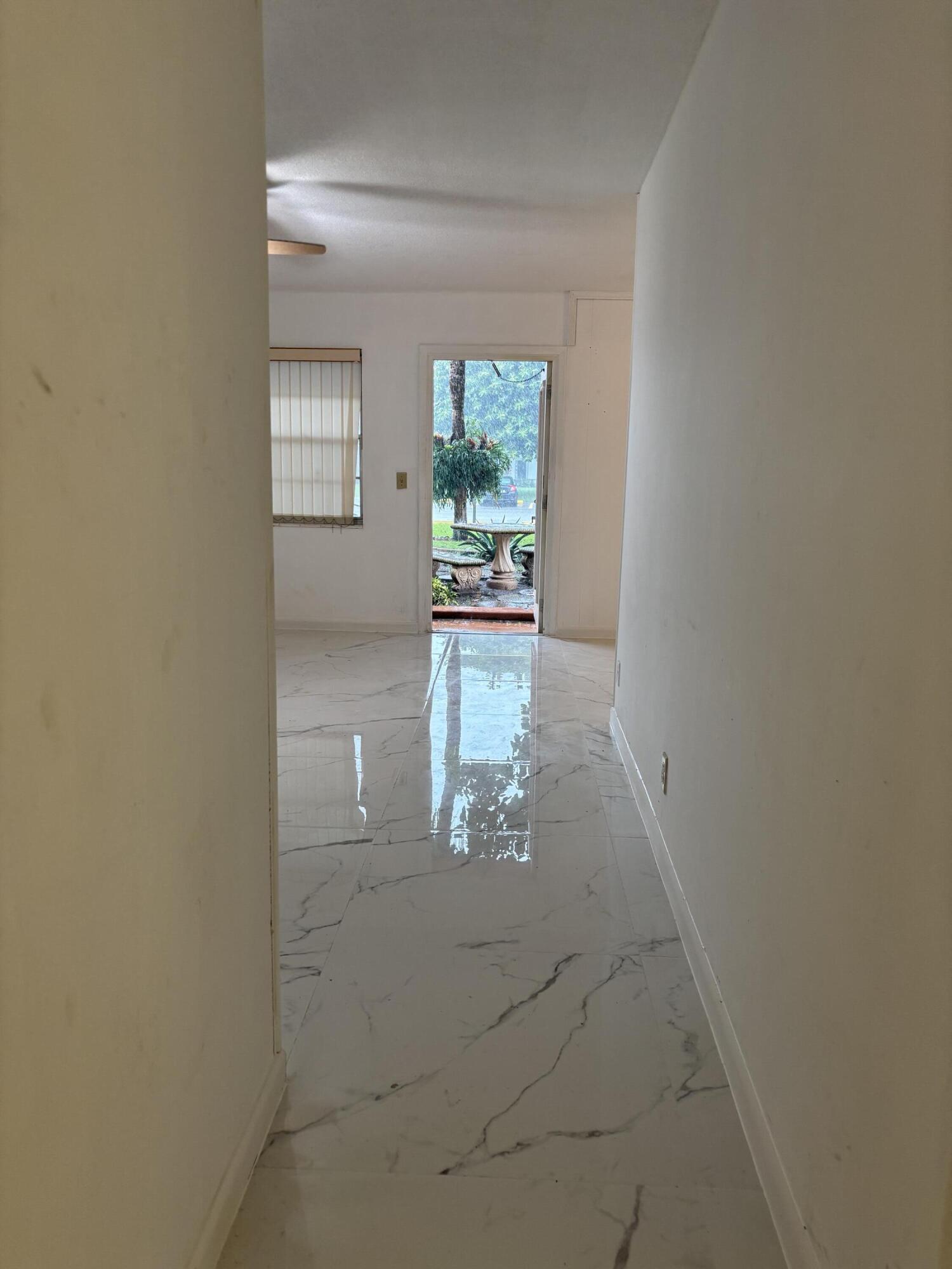 204 Salisbury I, Unit 204 West Palm Beach, FL 33417 - Photo 6 of 14 a view of entryway with kitchen