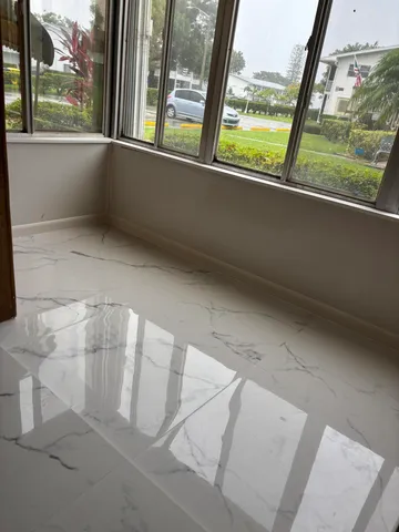 a view of empty room with large window