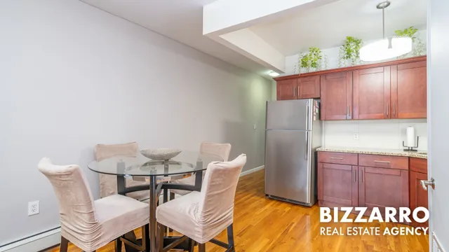 a kitchen with stainless steel appliances granite countertop a refrigerator and a stove
