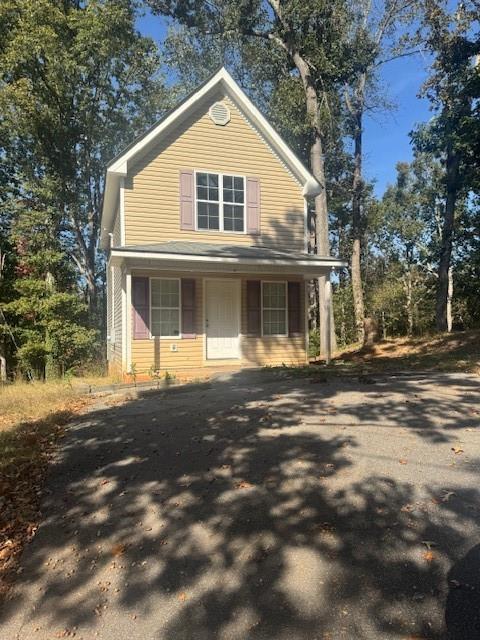 5380 Archer Avenue Cumming, GA 30041 - Photo 1 of 5 a front view of a house with a yard