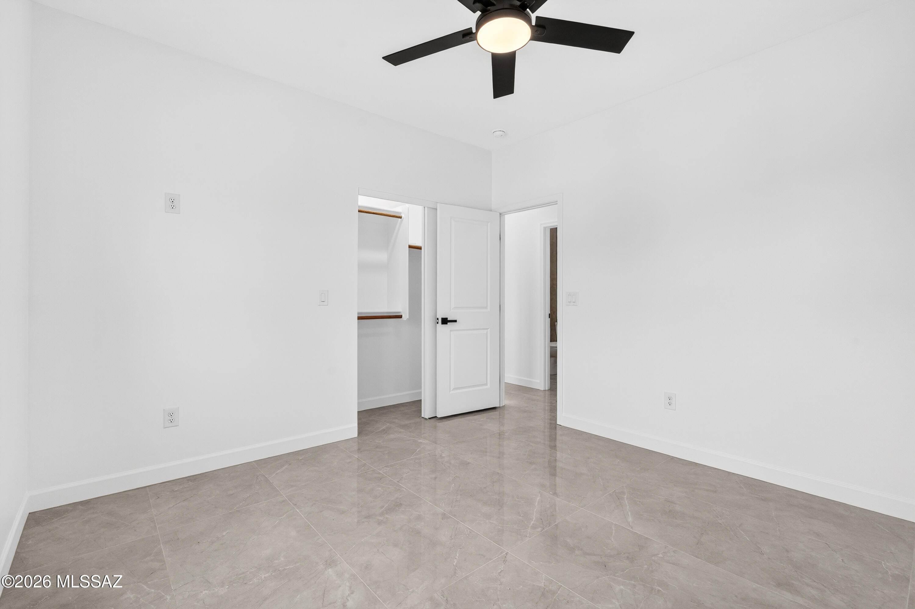 1834 Circulo Glorieta Rio Rico, AZ 85648 - Photo 25 of 35 an empty room with a ceiling fan and a window