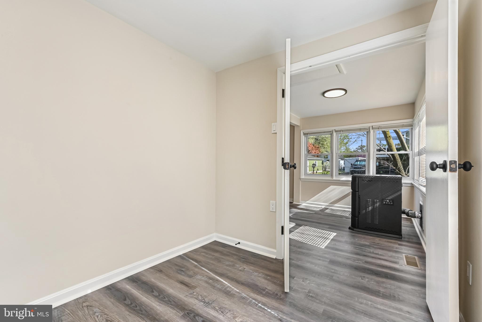 313 Orchard Road Edgewater, MD 21037 - Photo 11 of 48 a view of a room with wooden floor and furniture