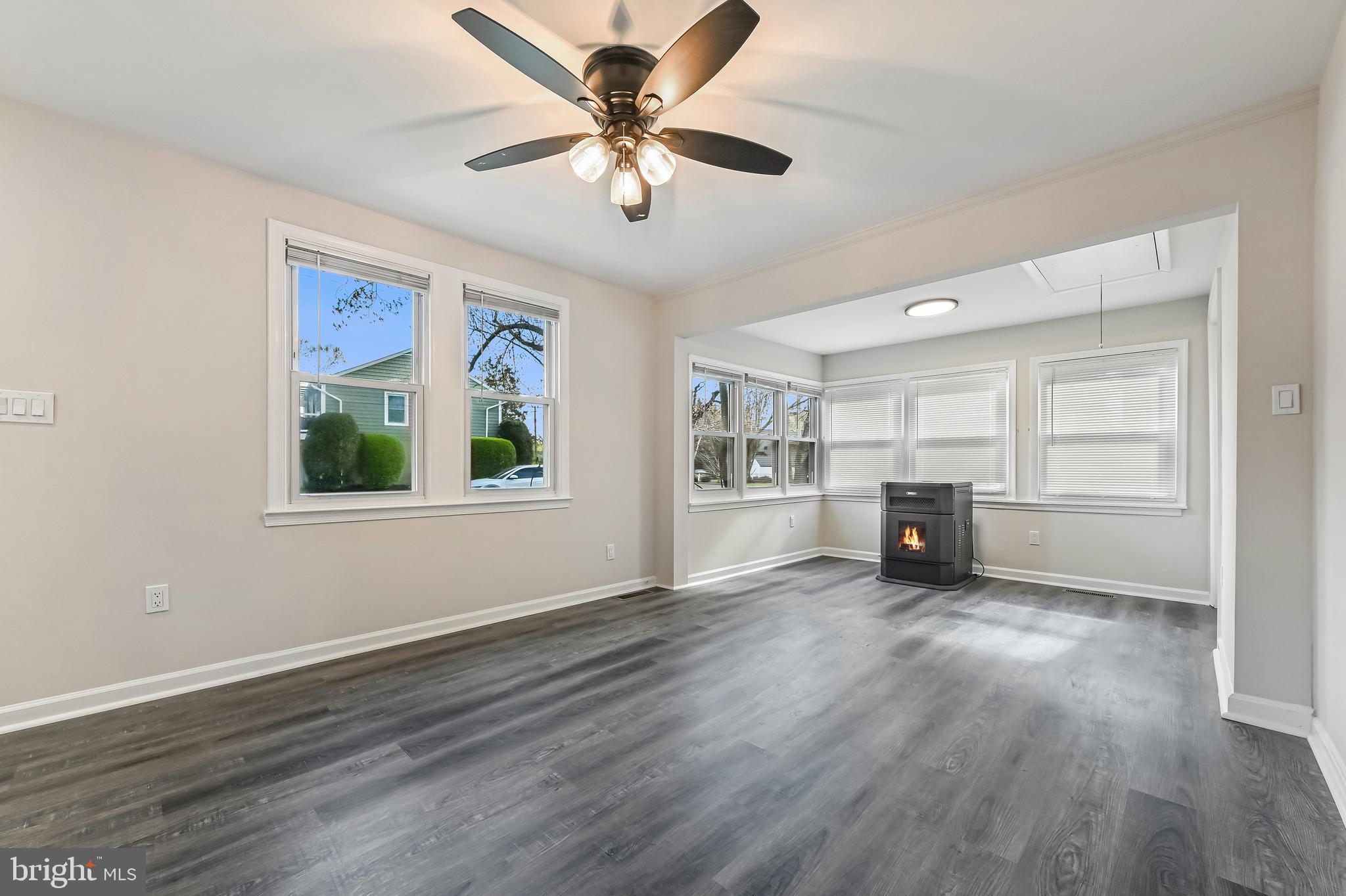 313 Orchard Road Edgewater, MD 21037 - Photo 12 of 48 a view of a livingroom with a flat screen tv ceiling fan and window