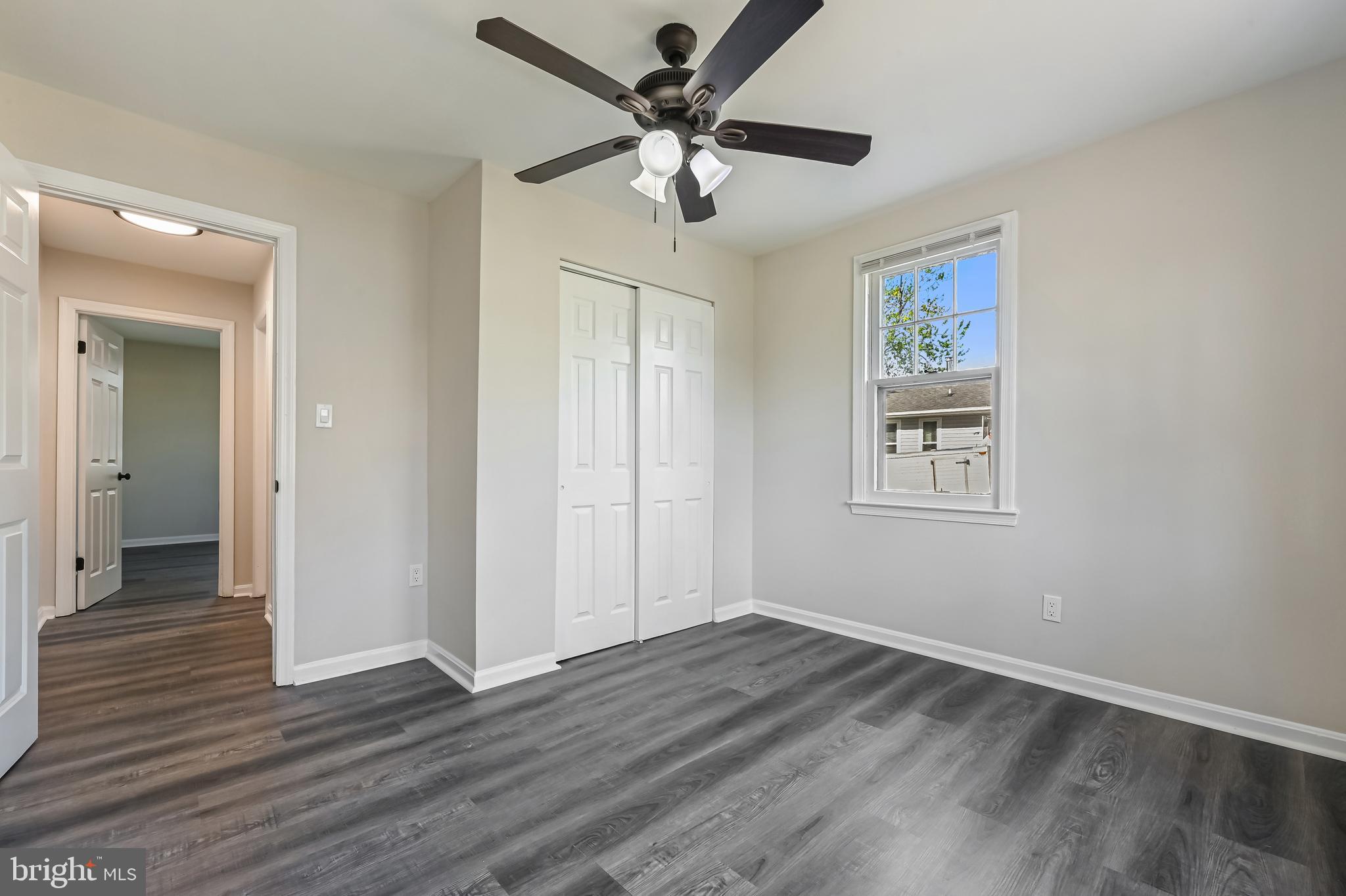 313 Orchard Road Edgewater, MD 21037 - Photo 13 of 48 wooden floor in an empty room with a window