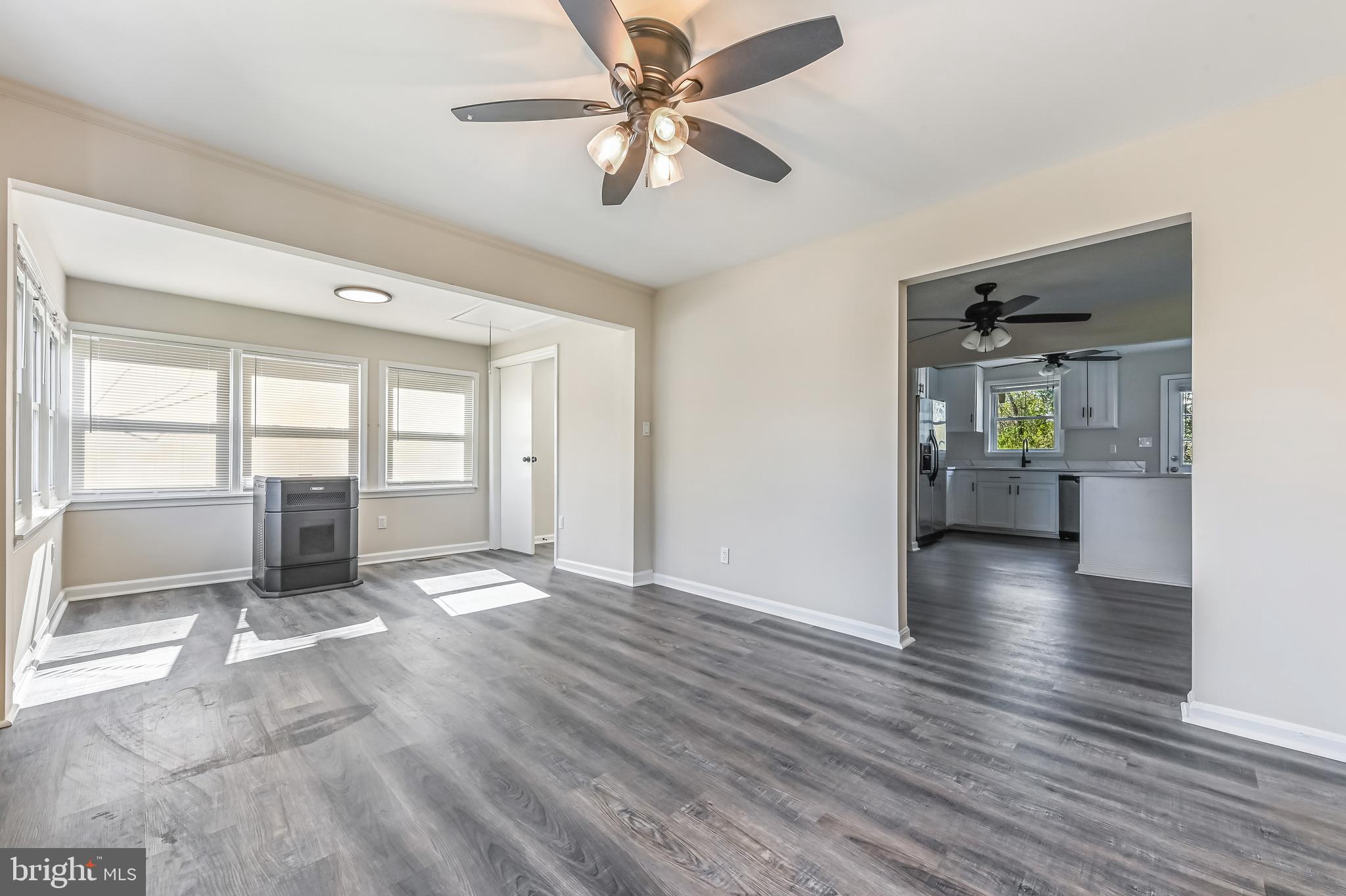 313 Orchard Road Edgewater, MD 21037 - Photo 19 of 48 a view of an empty room with window and wooden floor