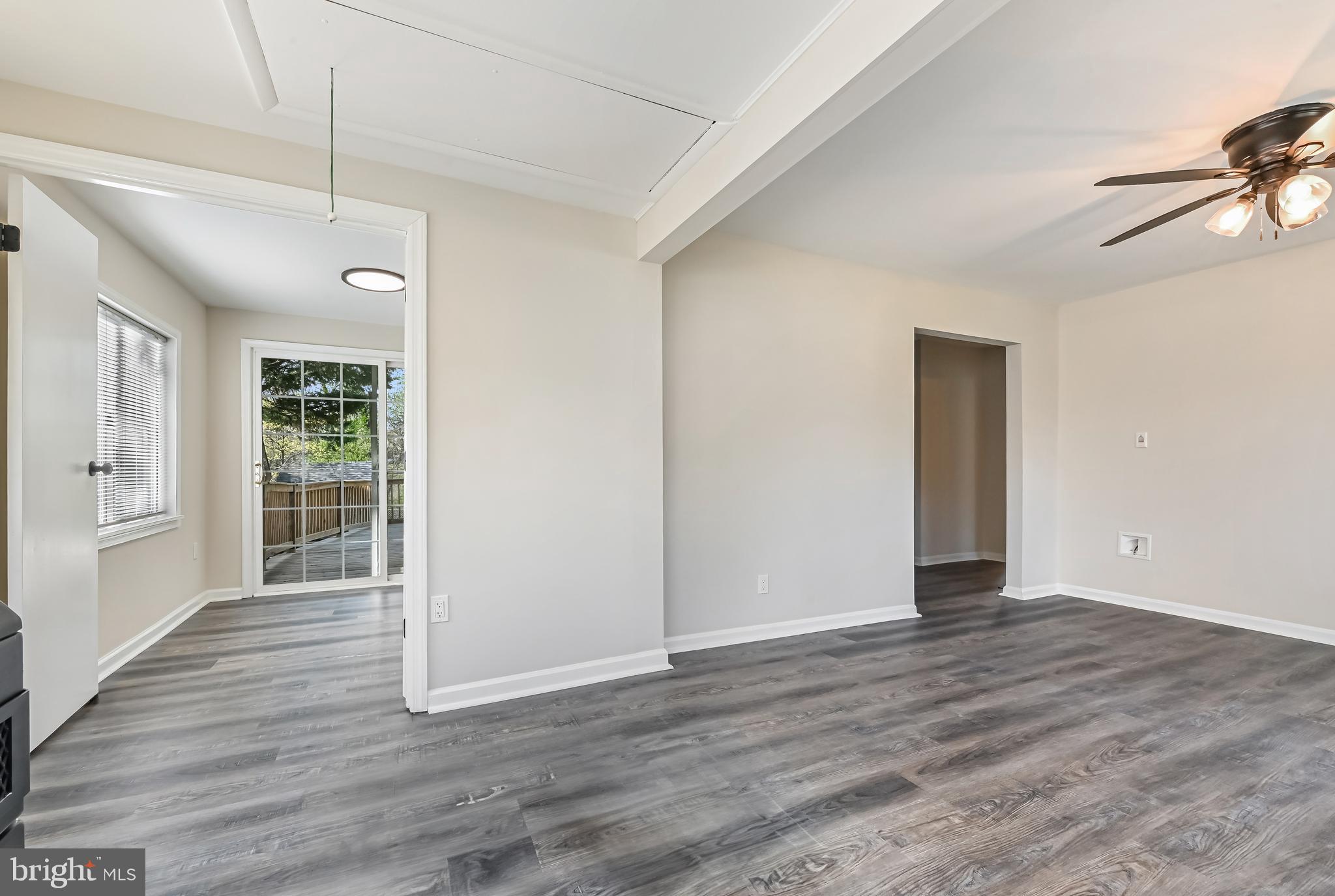 313 Orchard Road Edgewater, MD 21037 - Photo 20 of 48 a view of an empty room with wooden floor and a window