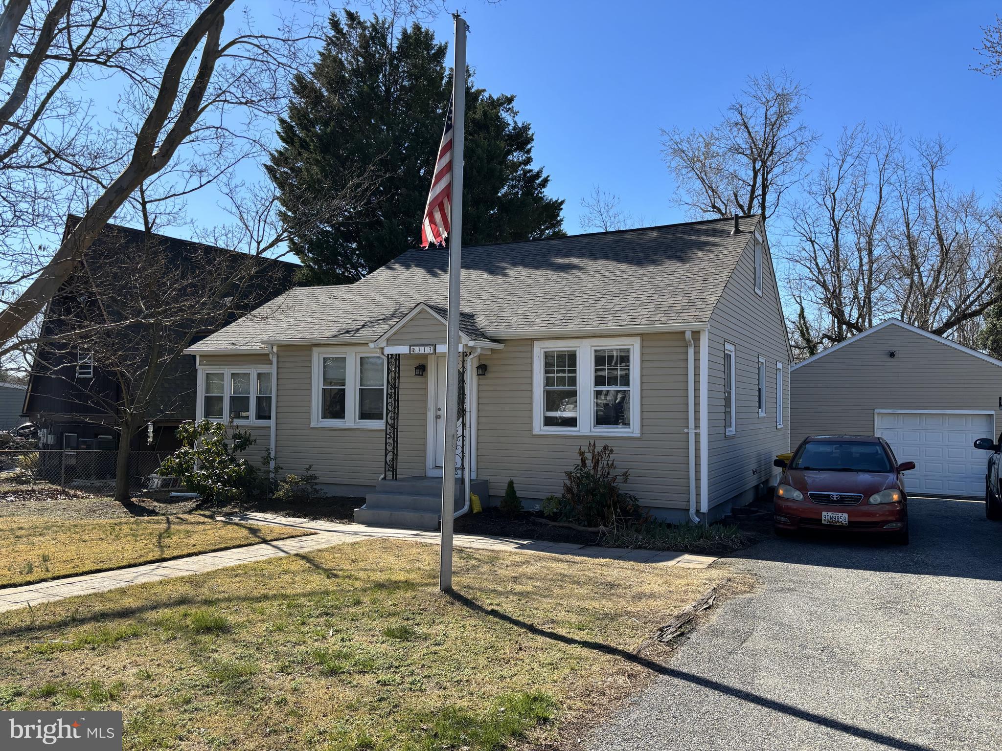313 Orchard Road Edgewater, MD 21037 - Photo 2 of 48 a front view of a house with a yard
