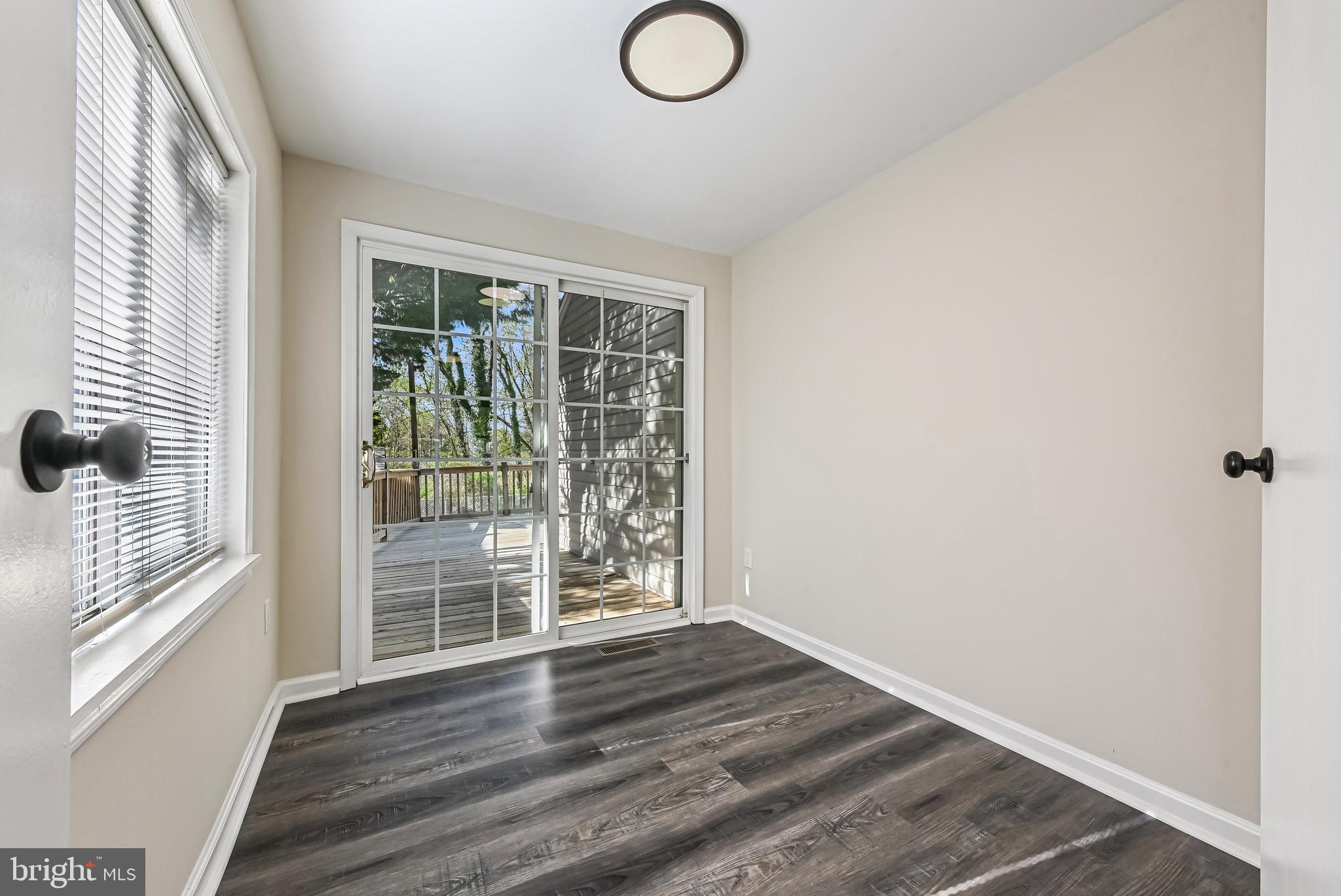 313 Orchard Road Edgewater, MD 21037 - Photo 21 of 48 a view of wooden floor and windows in a room