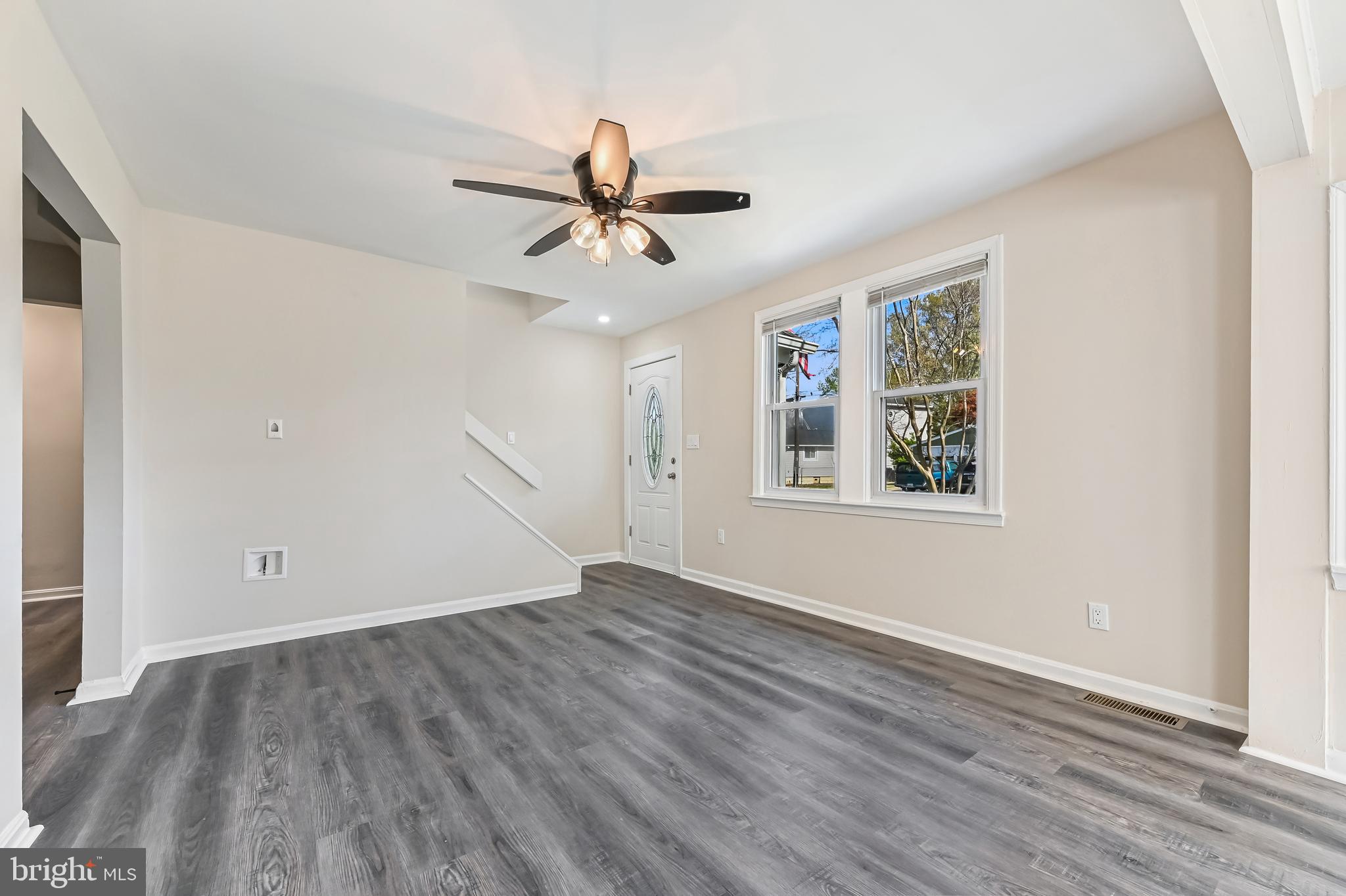 313 Orchard Road Edgewater, MD 21037 - Photo 22 of 48 a view of empty room with wooden floor and fan