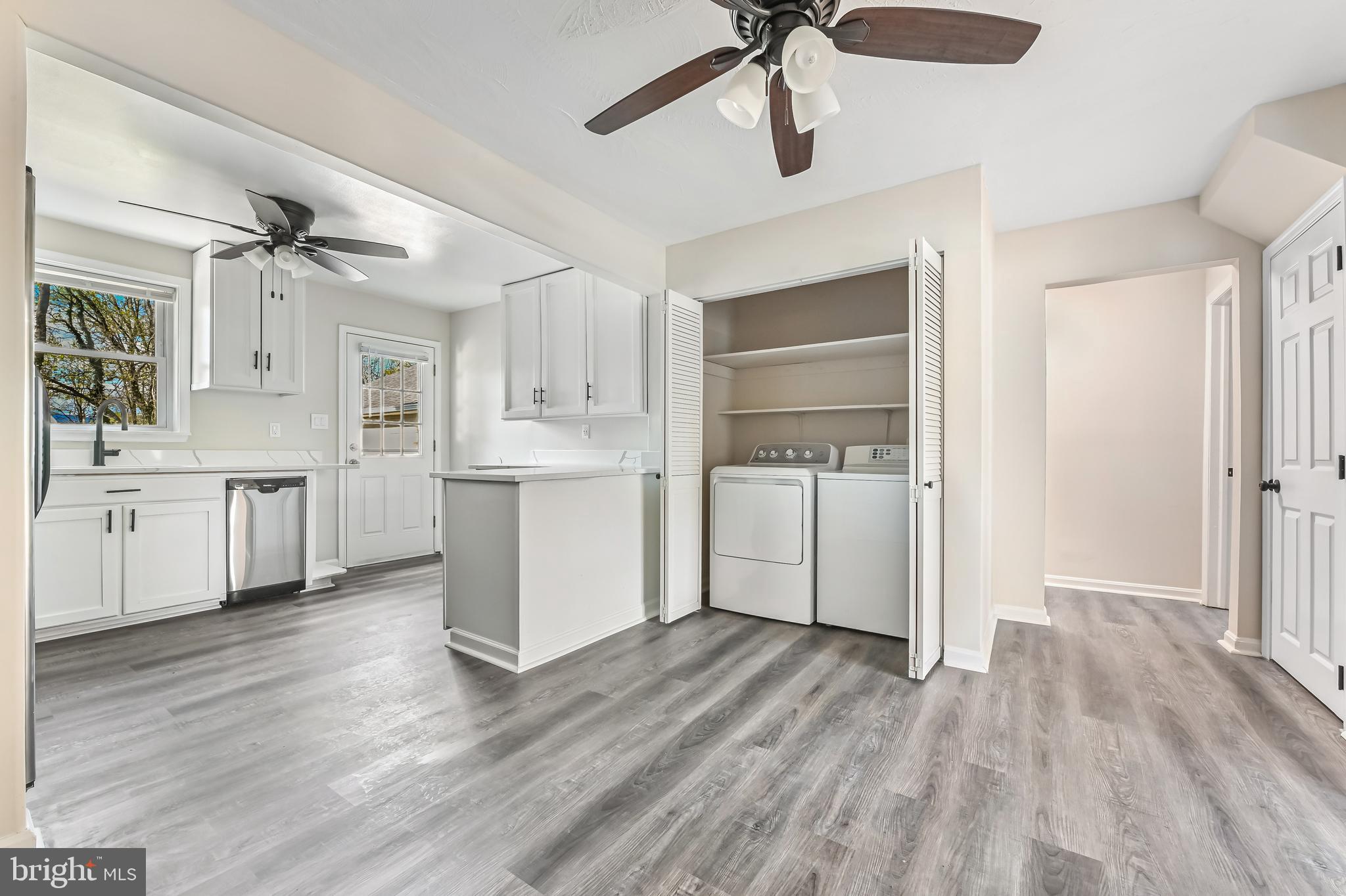 313 Orchard Road Edgewater, MD 21037 - Photo 24 of 48 a view of a kitchen with a sink cabinets and wooden floor