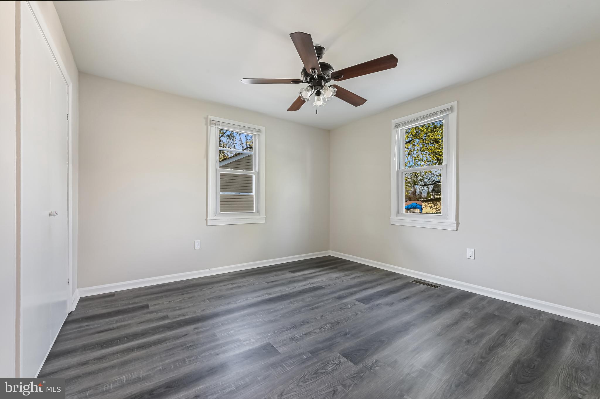 313 Orchard Road Edgewater, MD 21037 - Photo 27 of 48 a view of empty room with wooden floor and fan