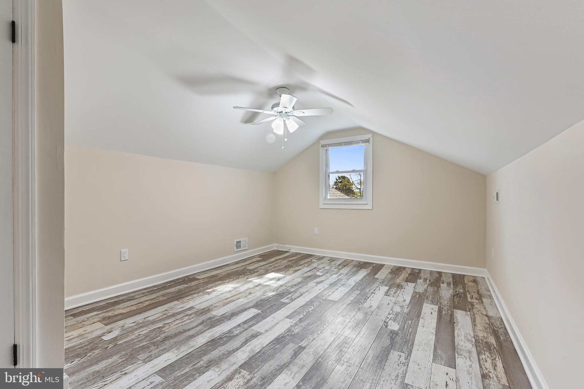 313 Orchard Road Edgewater, MD 21037 - Photo 28 of 48 a view of a room with wooden floor and a ceiling fan