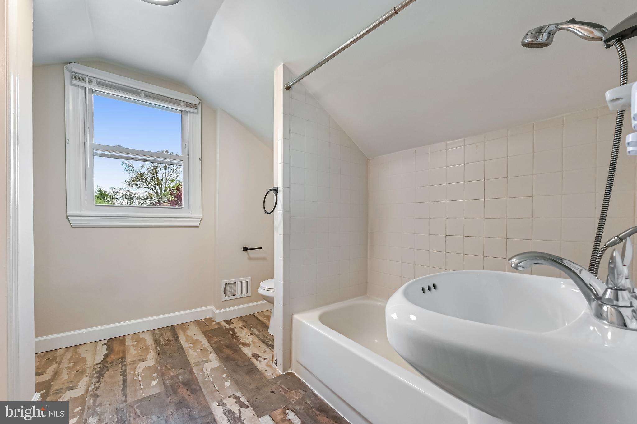 313 Orchard Road Edgewater, MD 21037 - Photo 30 of 48 a bathroom with a tub and a window