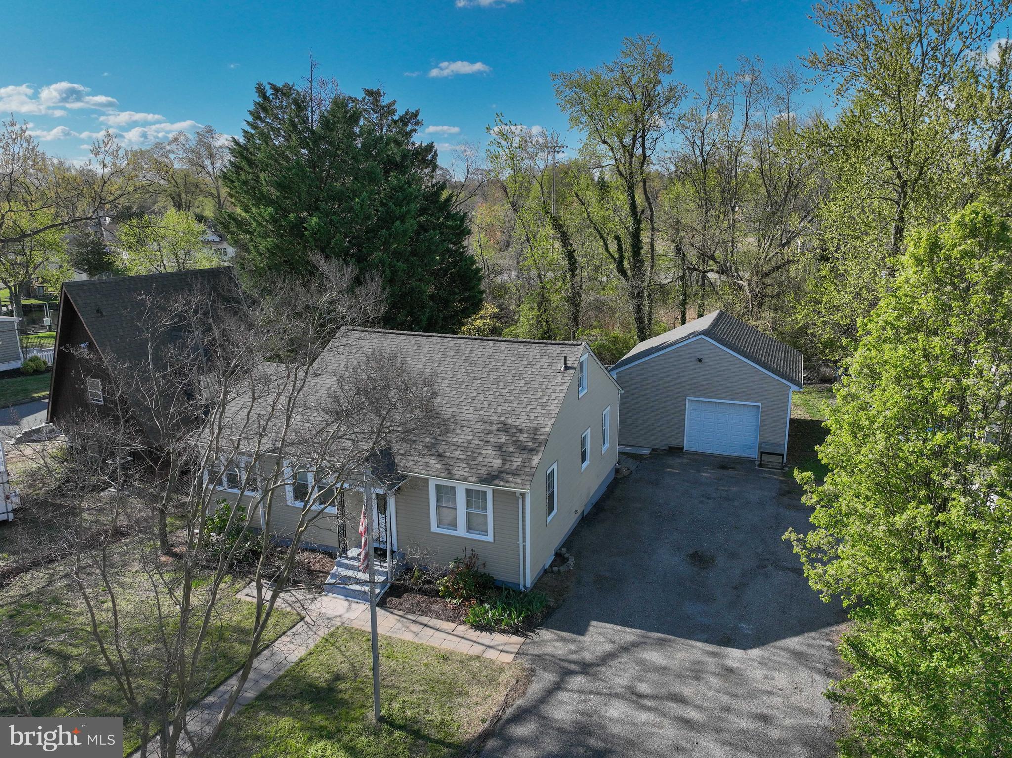 313 Orchard Road Edgewater, MD 21037 - Photo 31 of 48 a view of a house with a yard and tree s