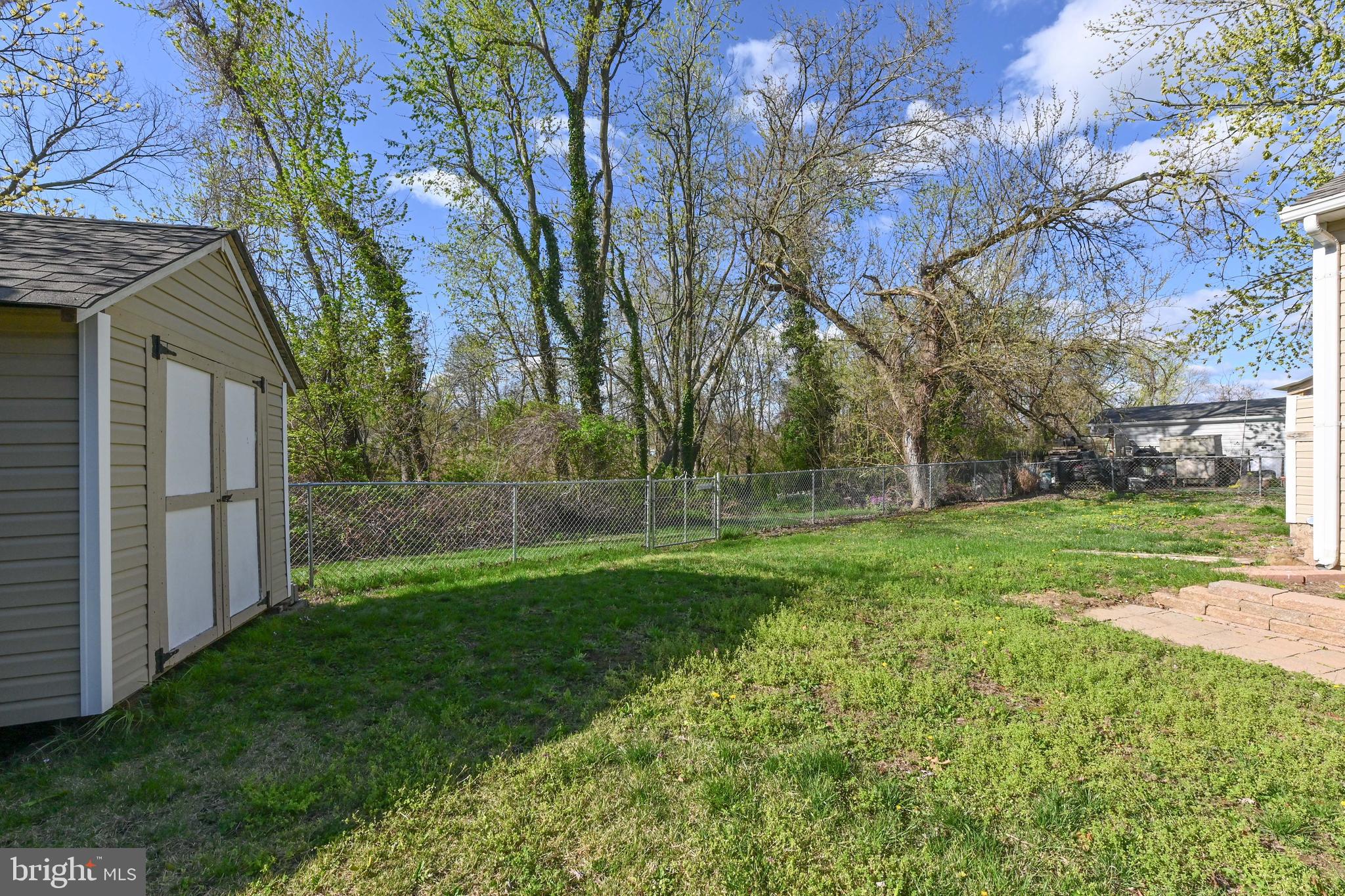 313 Orchard Road Edgewater, MD 21037 - Photo 36 of 48 a view of a backyard with large trees