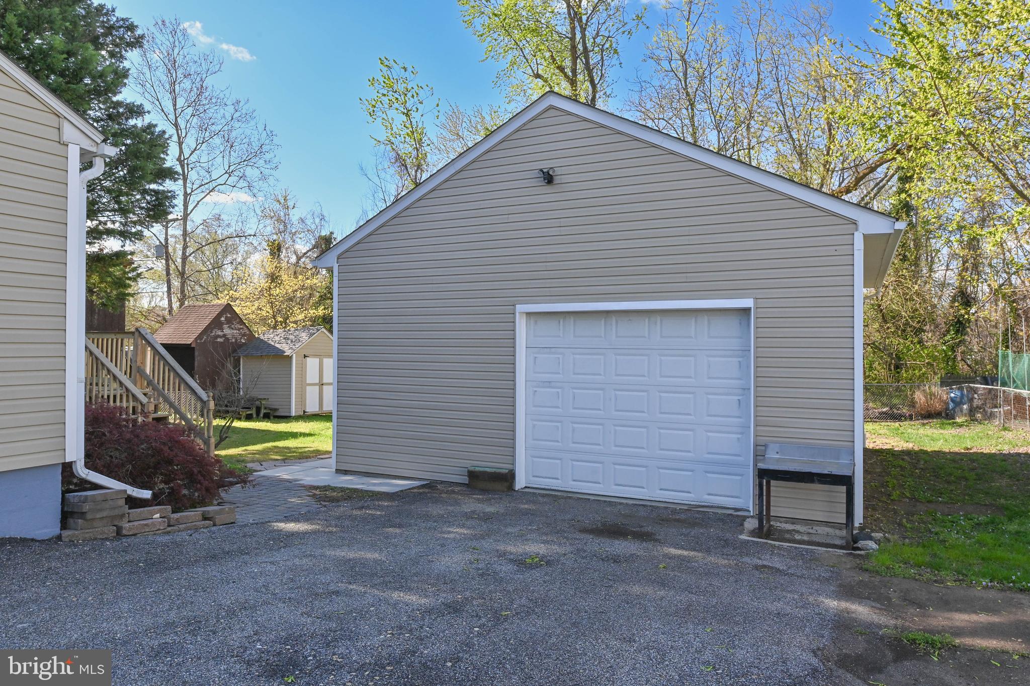 313 Orchard Road Edgewater, MD 21037 - Photo 37 of 48 a view of a house with a yard and garage