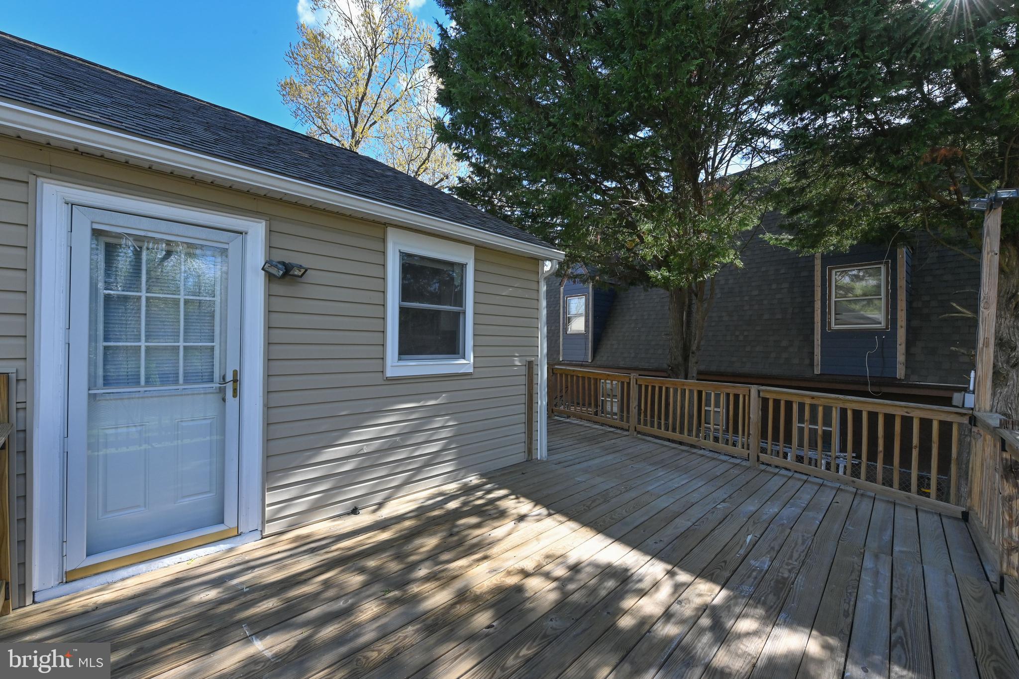 313 Orchard Road Edgewater, MD 21037 - Photo 38 of 48 a view of backyard with deck and wooden floor