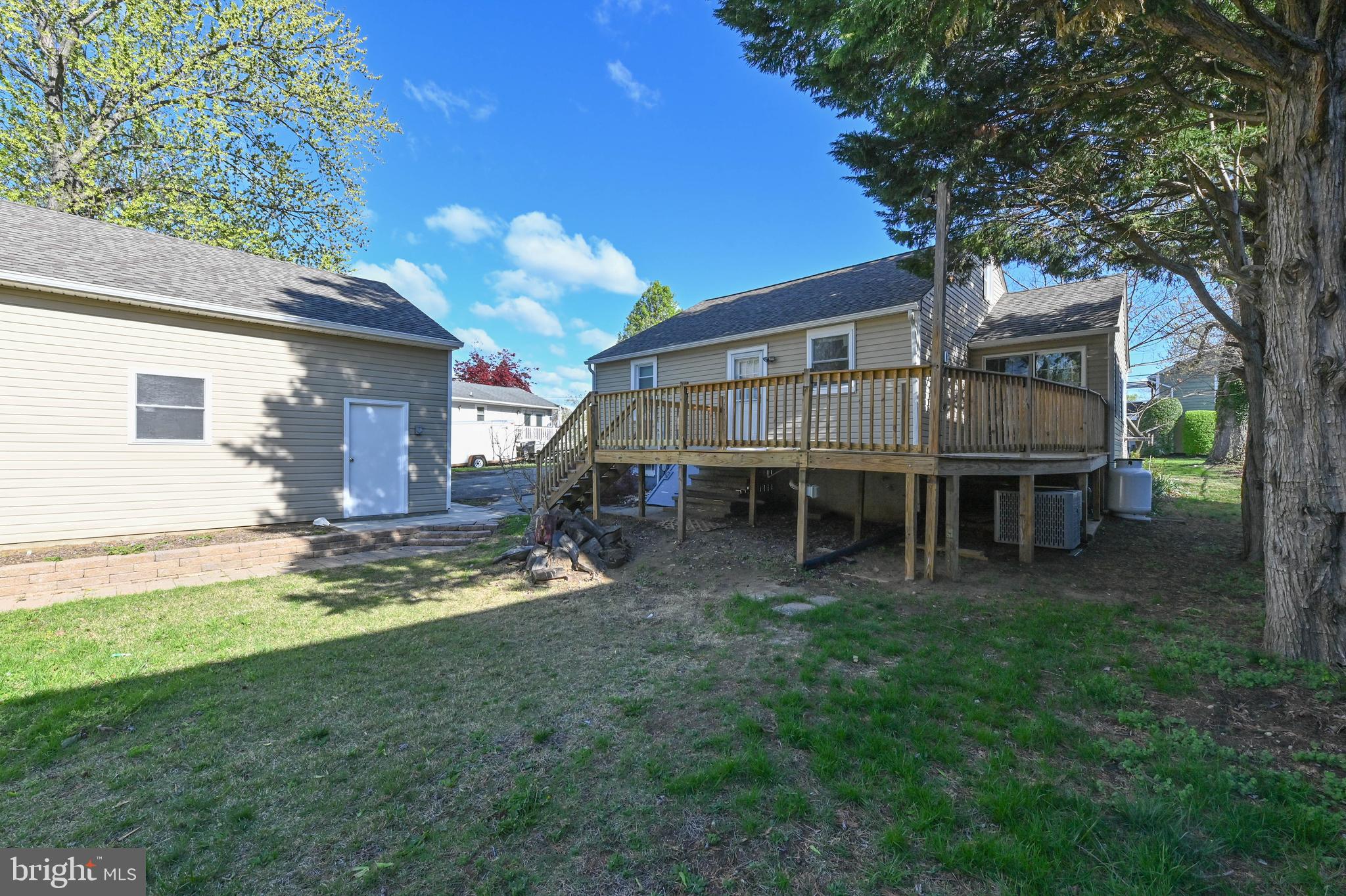 313 Orchard Road Edgewater, MD 21037 - Photo 39 of 48 a view of a house with a yard and sitting area