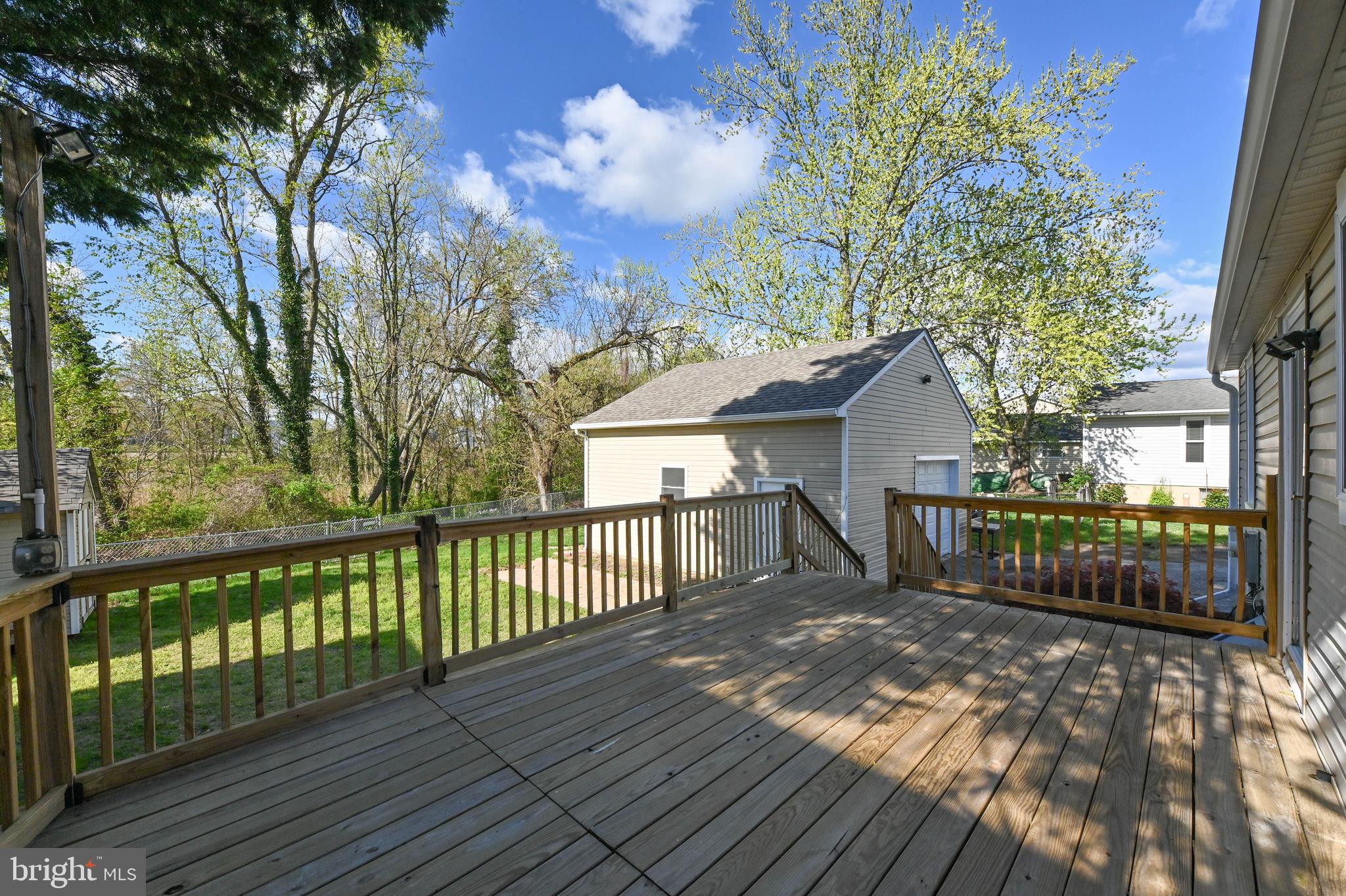 313 Orchard Road Edgewater, MD 21037 - Photo 40 of 48 a view of a wooden deck and a yard