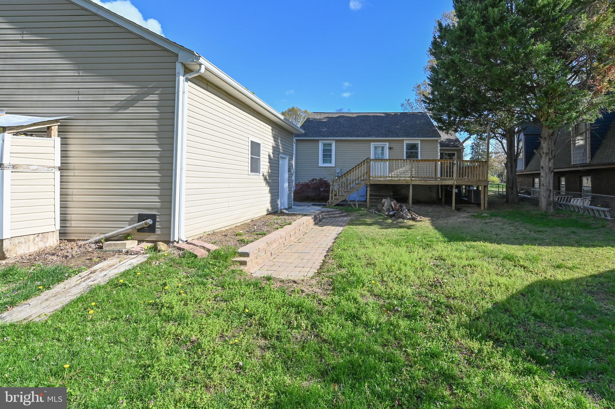 313 Orchard Road Edgewater, MD 21037 - Photo 41 of 48 a view of a house with a patio and a yard