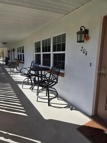 a view of a livingroom with furniture and front door