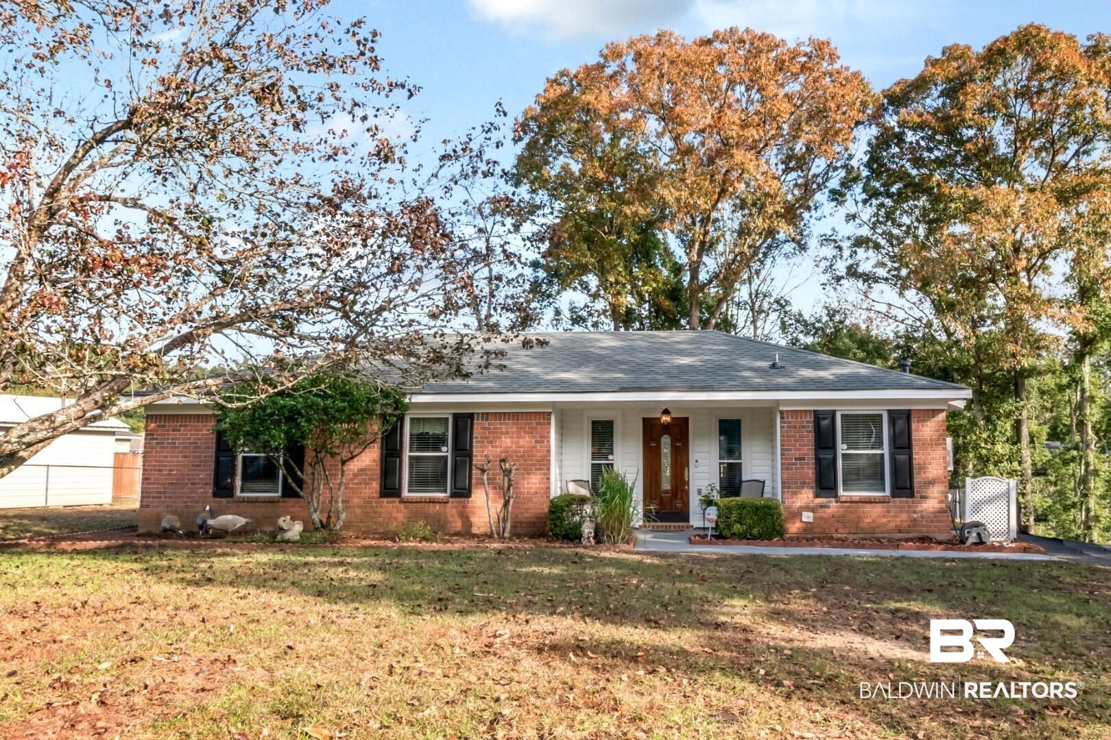 9360 Burnt Tree Drive Mobile, AL 36695 - Photo 1 of 28 Ranch-style house with covered porch and a front lawn