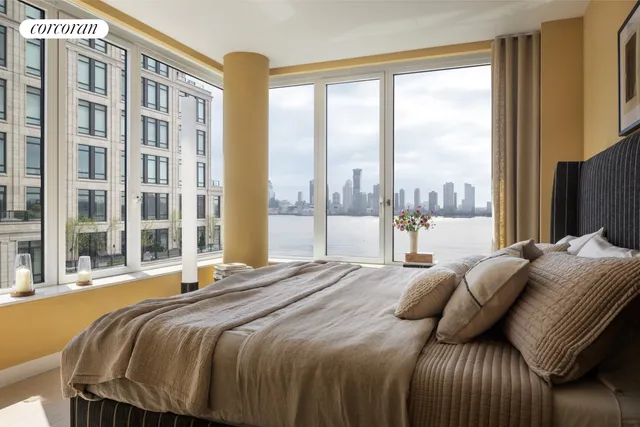 a bedroom with furniture and a window