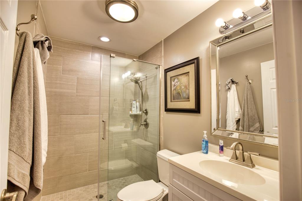 744 Cadiz Road, Unit 2 Venice, FL 34285 - Photo 19 of 26 a bathroom with a sink toilet and shower