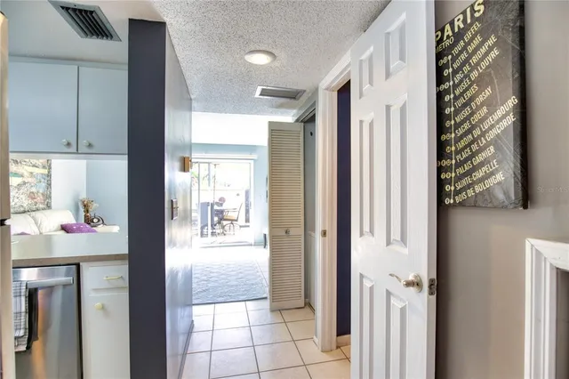 a view of a kitchen from the hallway