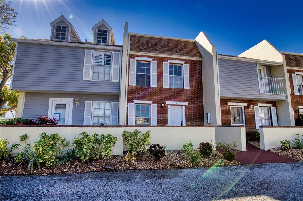 744 Cadiz Road, Unit 2 Venice, FL 34285 - Photo 26 of 26 a front view of a house with a yard