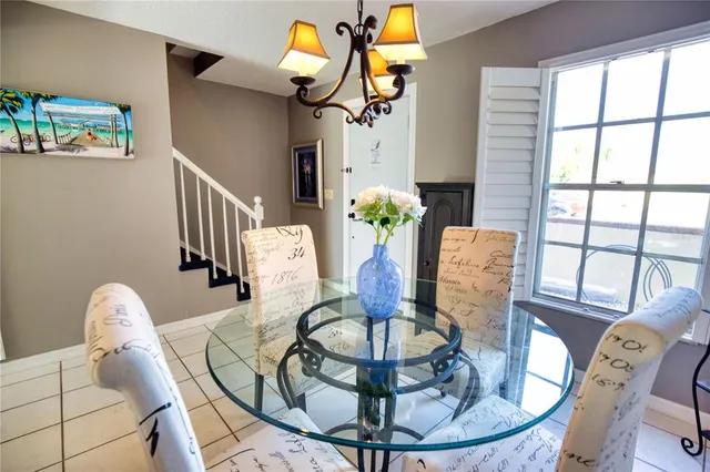 a view of a dining room with furniture wooden floor and chandelier