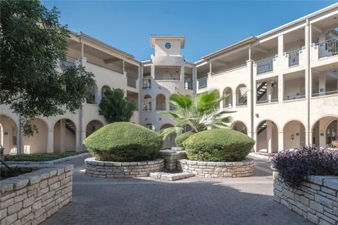 a front view of a building with garden