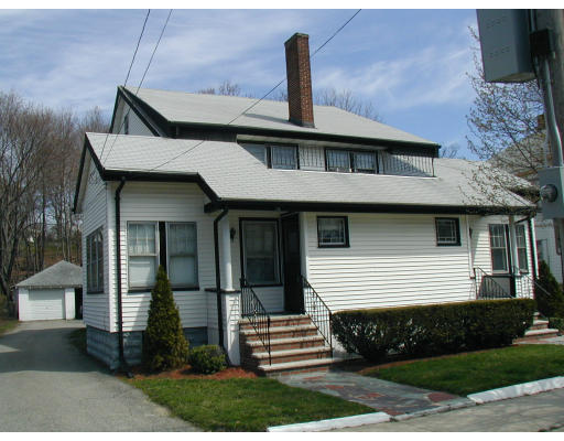 17-19 Lawrence Road Medford, MA 02155 - Photo 1 of 1 a front view of a house with a garden