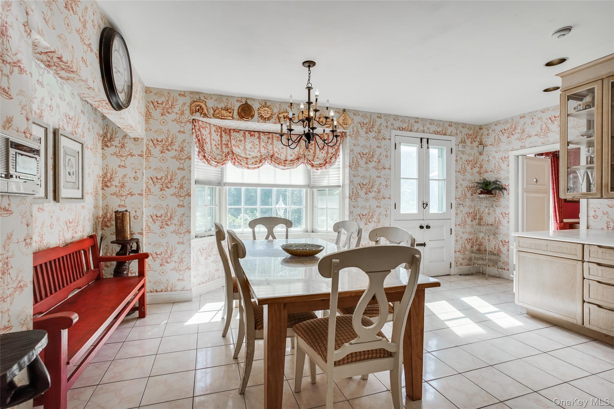 274 River Road St. James, NY 11780 - Photo 13 of 30 a view of a dining room with furniture window and wooden floor