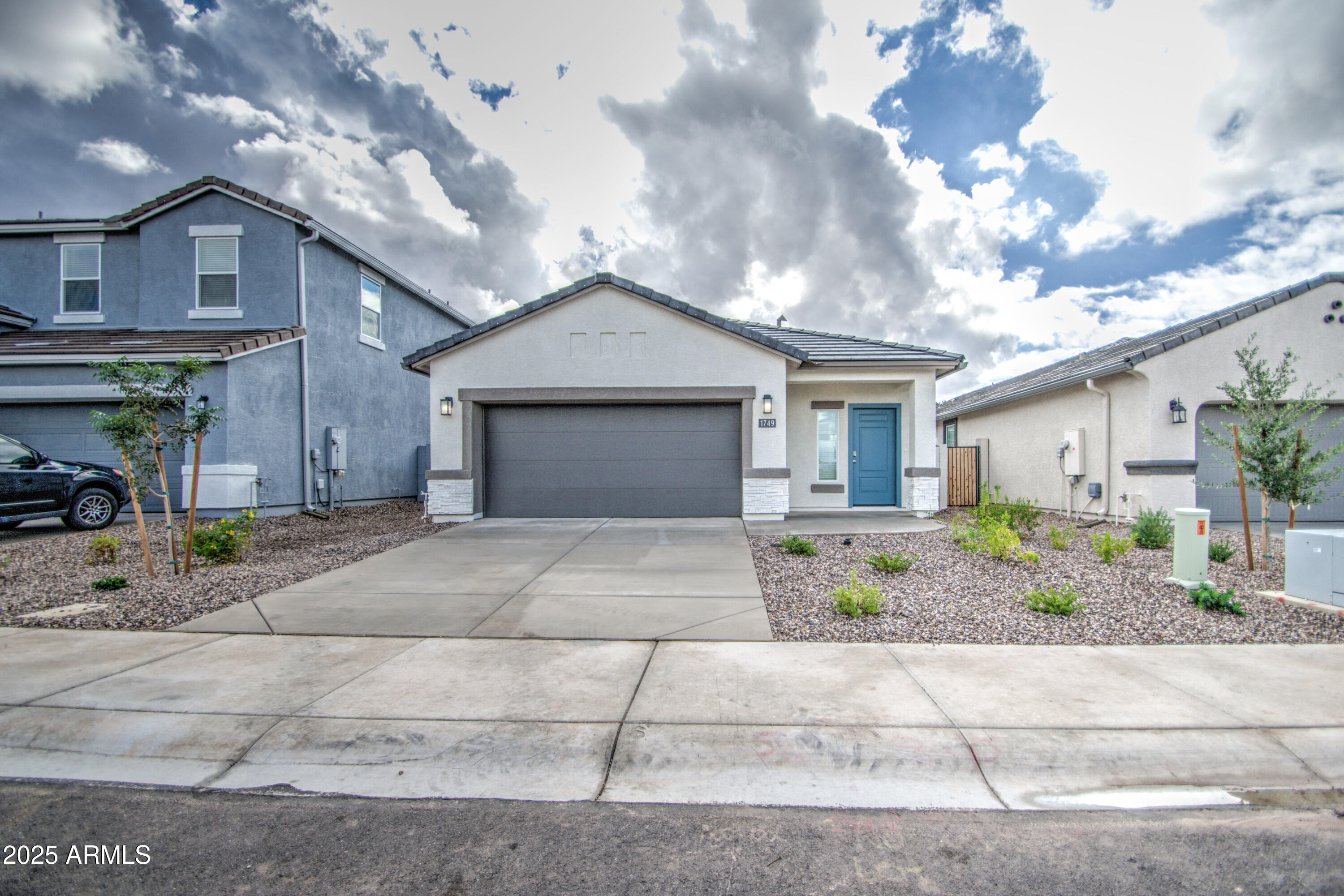 1749 West Stealth Avenue Apache Junction, AZ 85120 - Photo 1 of 48 a front view of a house with garden
