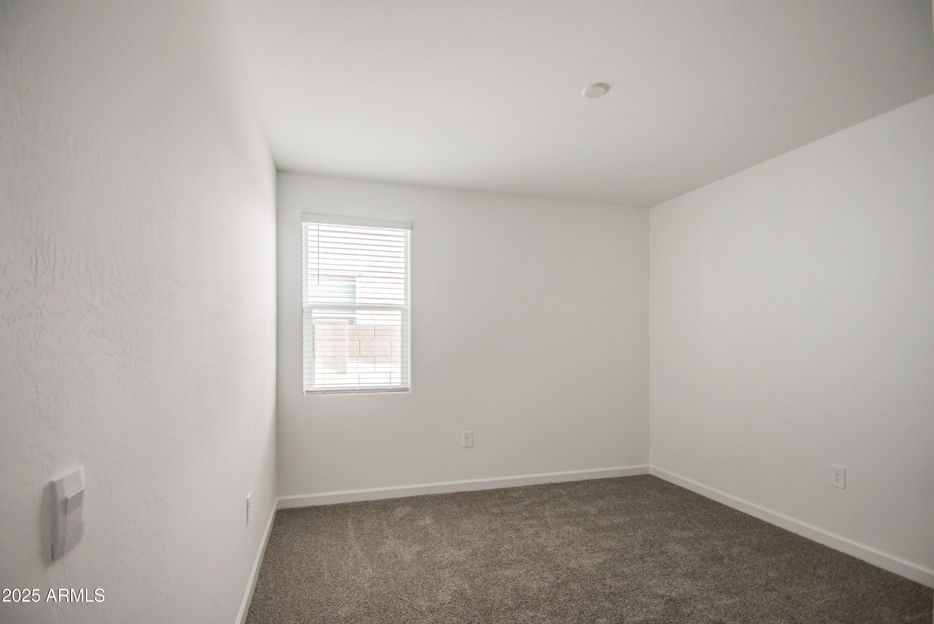 1749 West Stealth Avenue Apache Junction, AZ 85120 - Photo 18 of 48 an empty room with a window