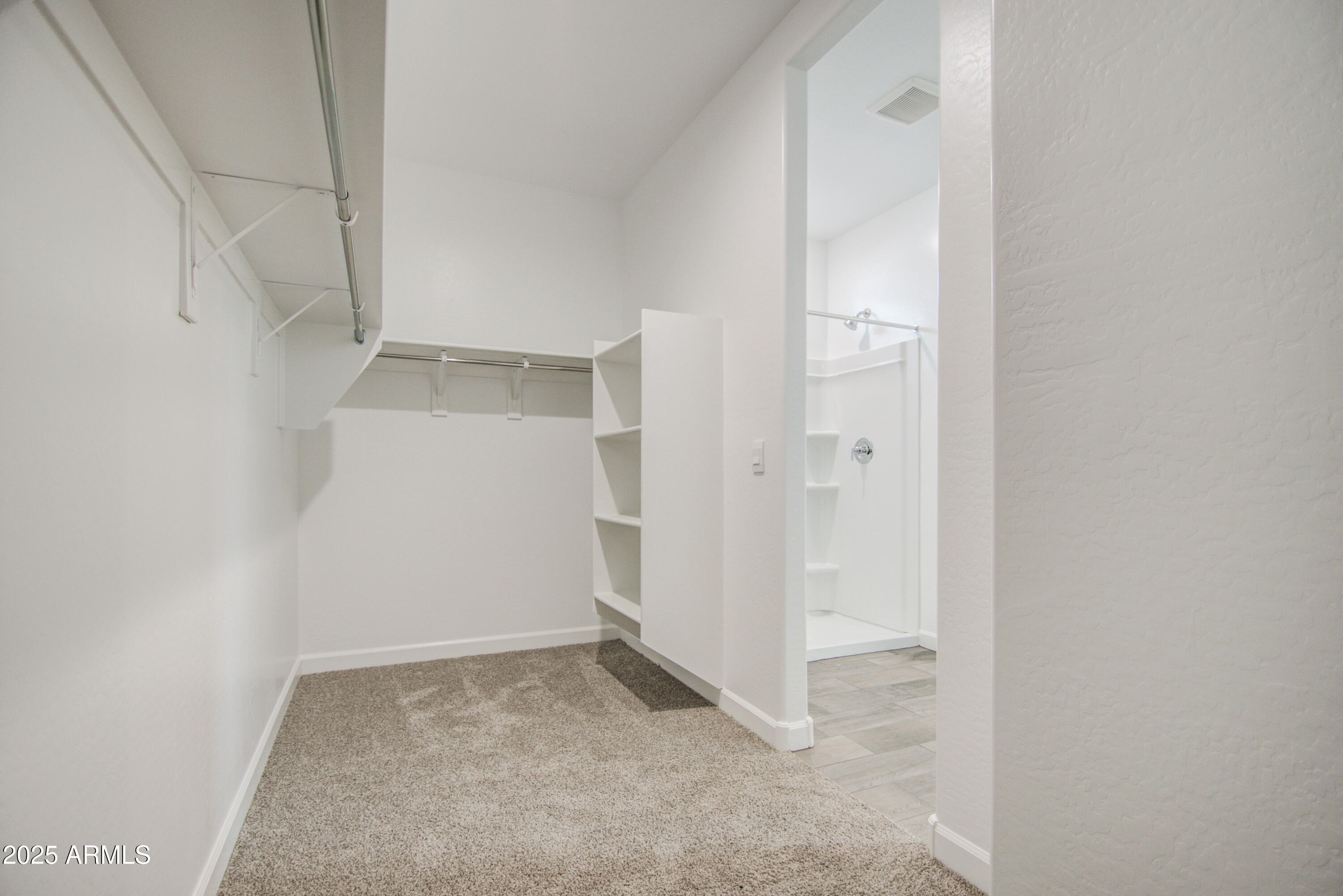 1749 West Stealth Avenue Apache Junction, AZ 85120 - Photo 26 of 48 an empty room with a hallway