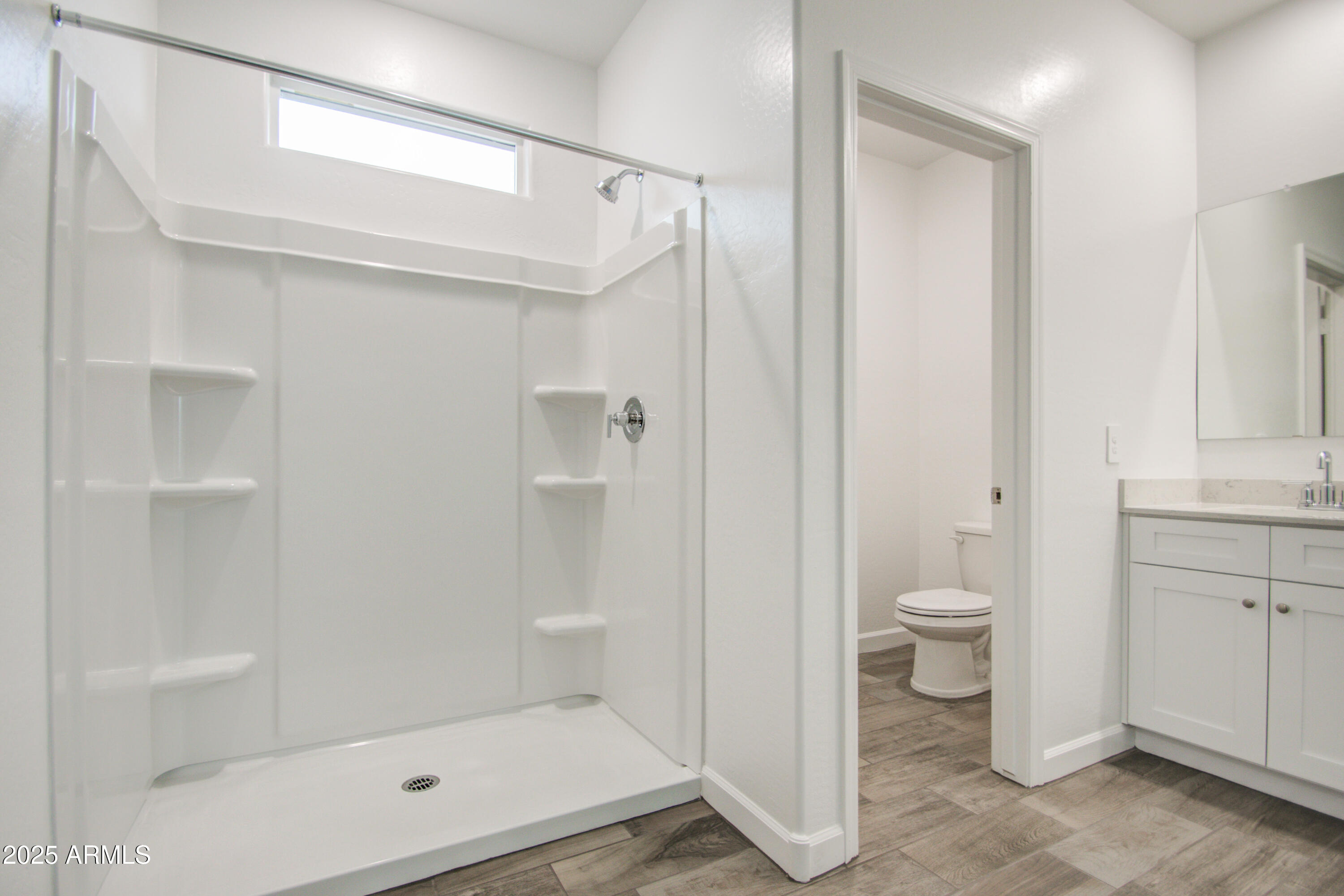 1749 West Stealth Avenue Apache Junction, AZ 85120 - Photo 29 of 48 a bathroom with a shower a toilet and a sink