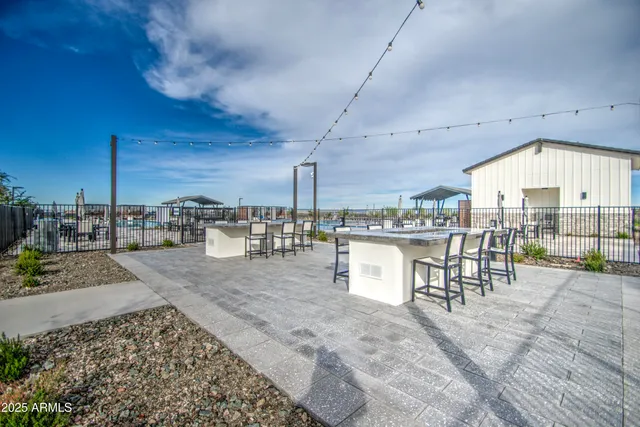 a living room with fireplace furniture and a potted plant