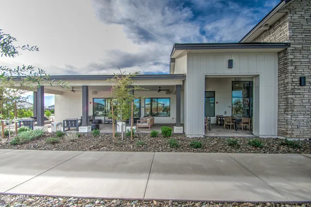 a lobby with furniture and floor to ceiling window