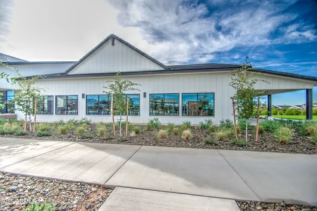 a living room with furniture kitchen view and a fireplace