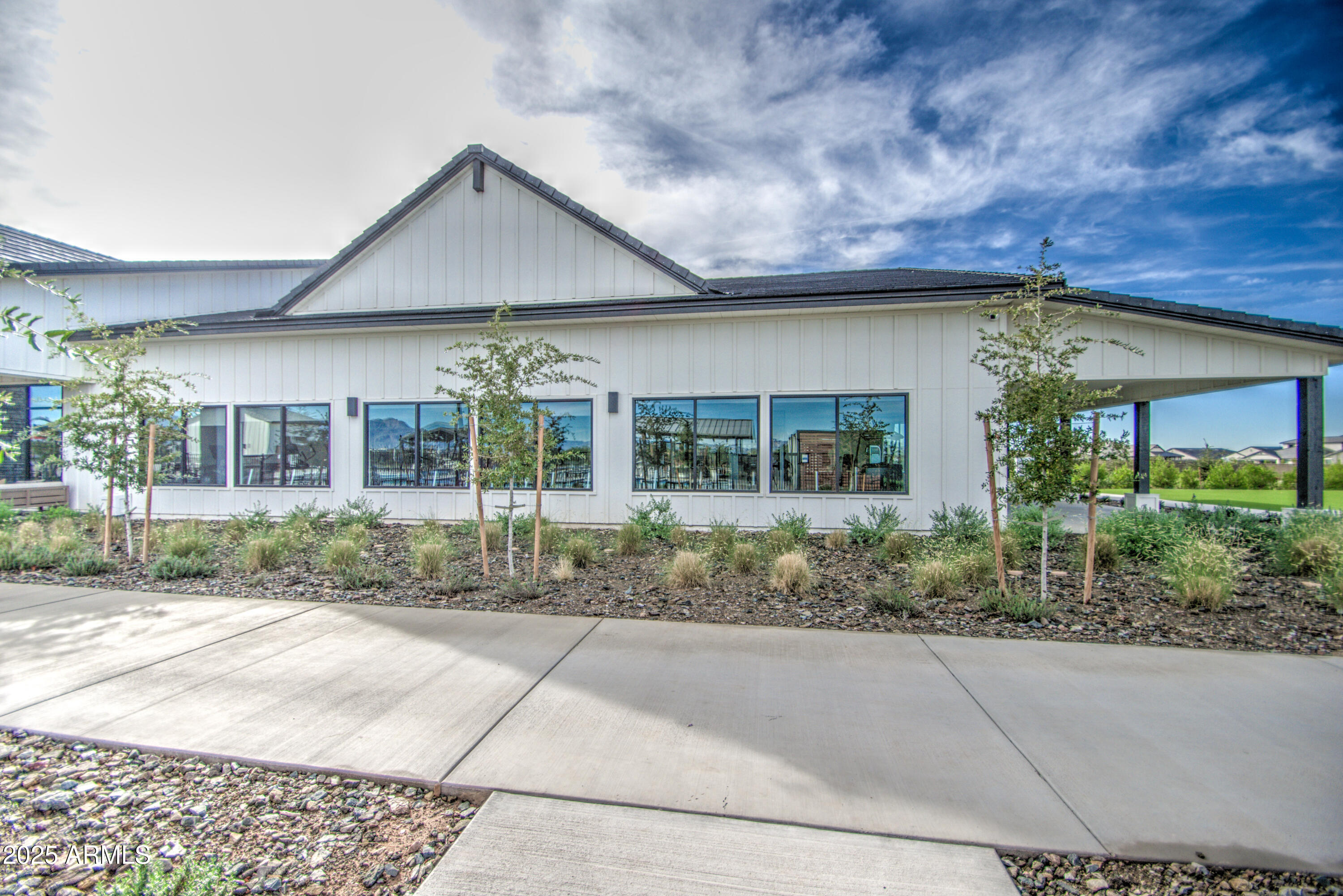 1749 West Stealth Avenue Apache Junction, AZ 85120 - Photo 40 of 48 front view of a house with a garden